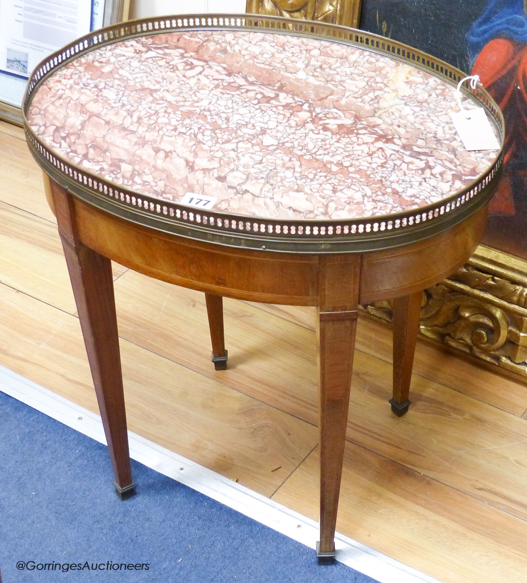 A Louis XVI style oval mahogany occasional table, marble top, 50 cm wide, 37.5 cm deep, 52 cm high